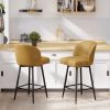 The bar stools feature an arched backrest and seat design, and are paired with black metal thin legs